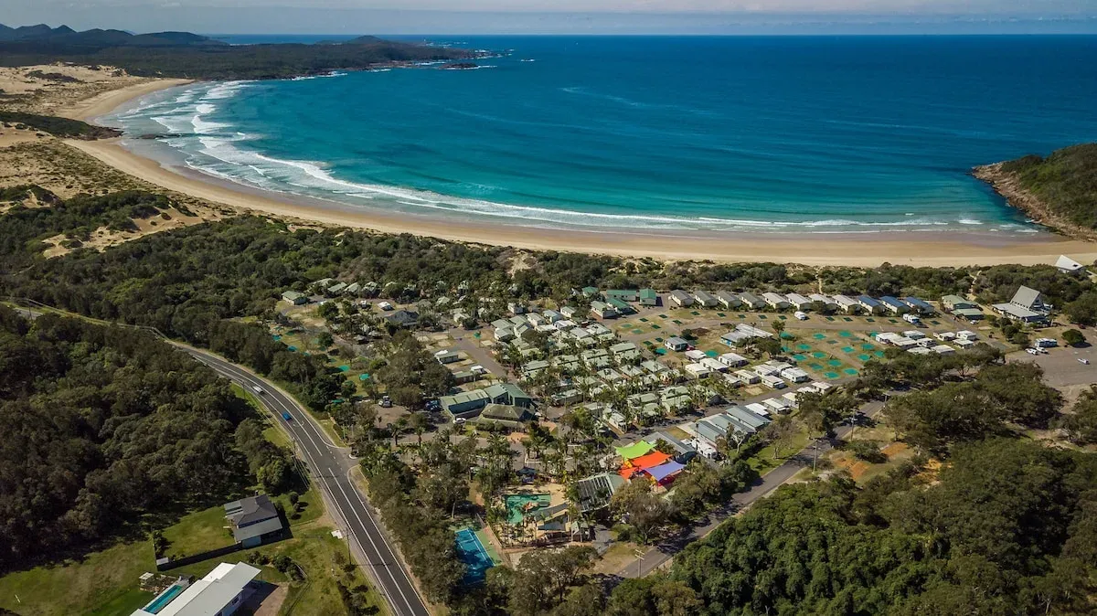 Ingenia Holidays One Mile Beach villas and pool near the beach, seen from above